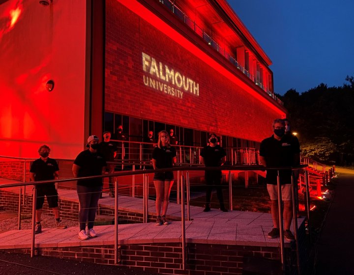 Falmouth University AMATA building shines red in support of #WeMakeEvents