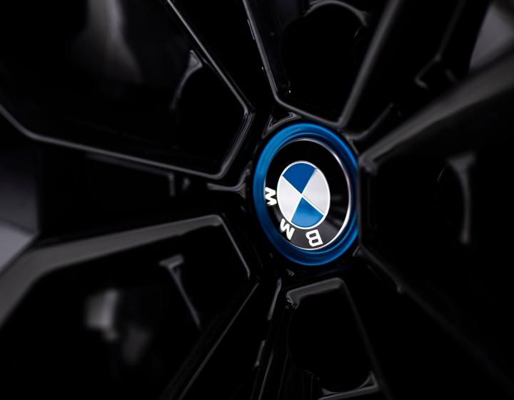 The BMW iX3 wheel shot - close up on logo