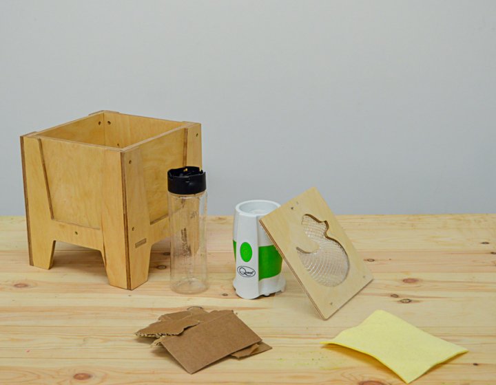 Wooden box with duck panel and a plastic bottle