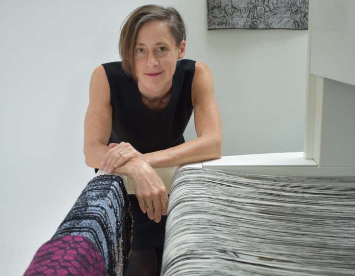 Fiona Sperryn In a textile studio with a weave