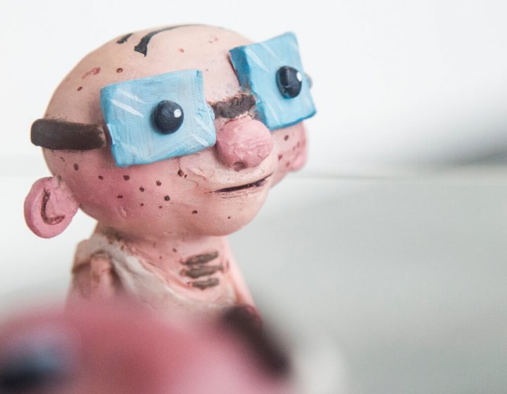 Animation BA(Hons) model of a bald man wearing large blue glasses