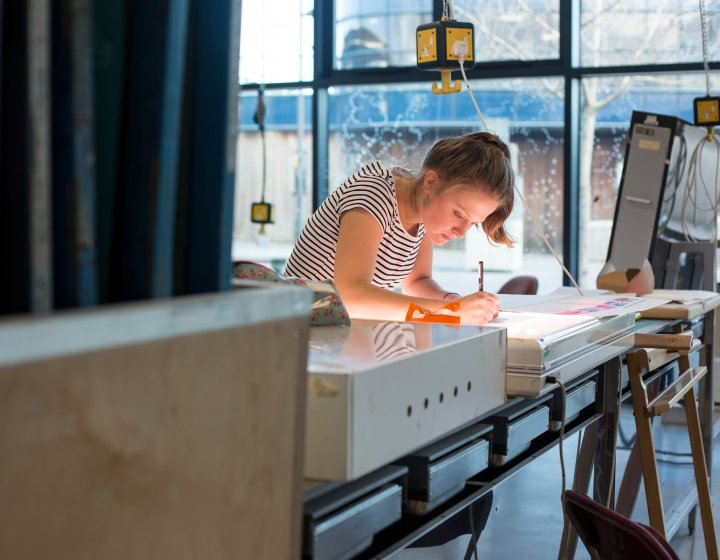 Female student working in textiles studio