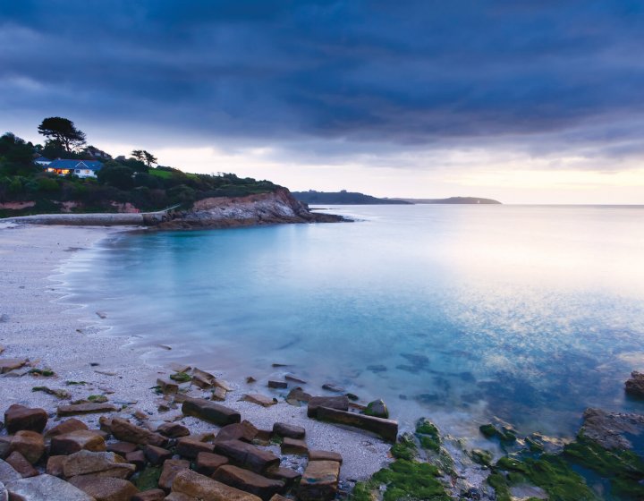View of Swanpool beach at dusk