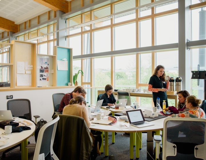 Students sat around a table in the AIR building