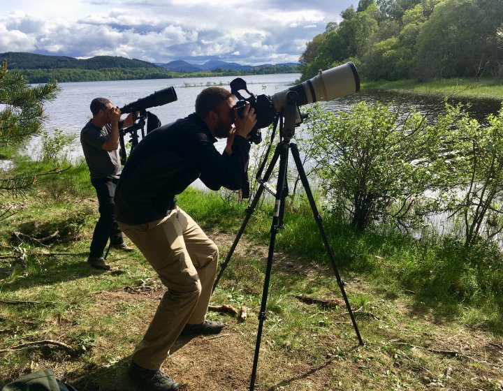 Two men with cameras on tripods