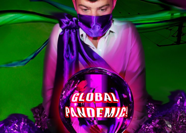 Boy wearing a purple cloak with a crystal ball