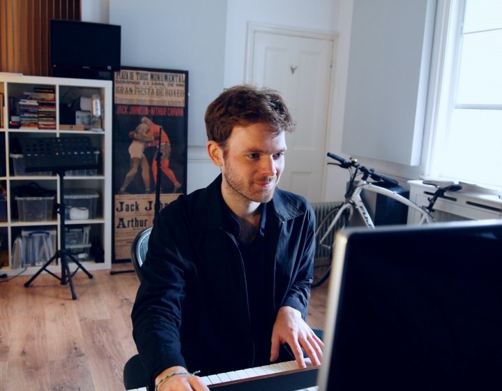Graduate, Joe Donohoe, on the piano