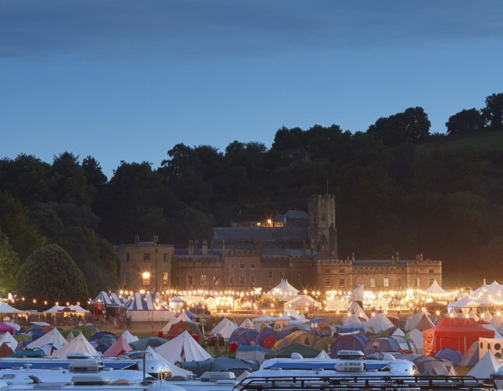 View of Port Eliot house at the festival, foreground covered in tents.