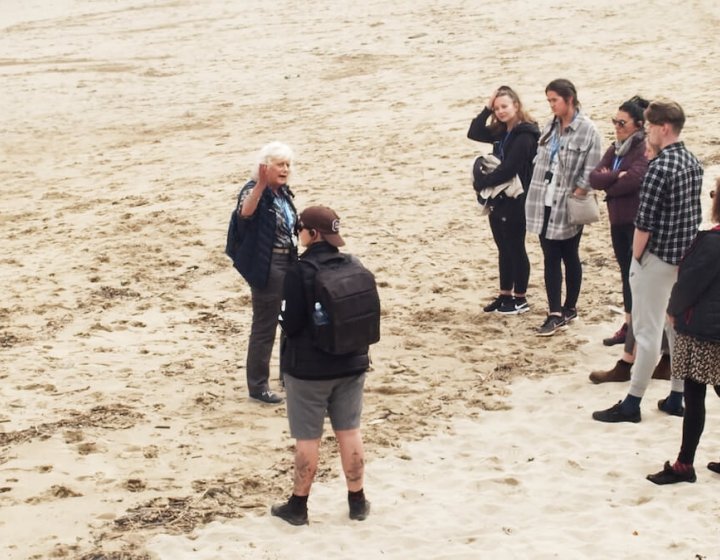 Sustainable Tourism Management students with tour guide on Portreath beach