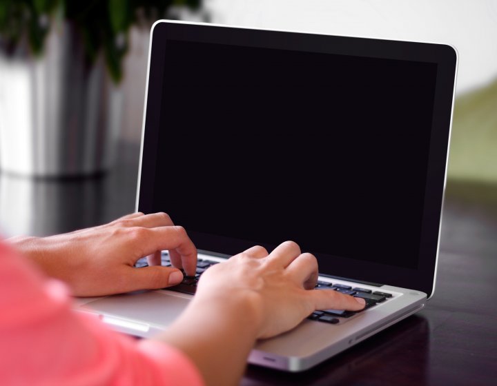 Person typing on a laptop