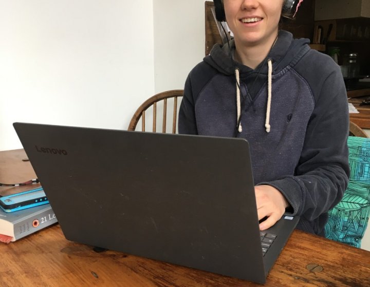 student records her contribution for the first radio show from her dining table at home