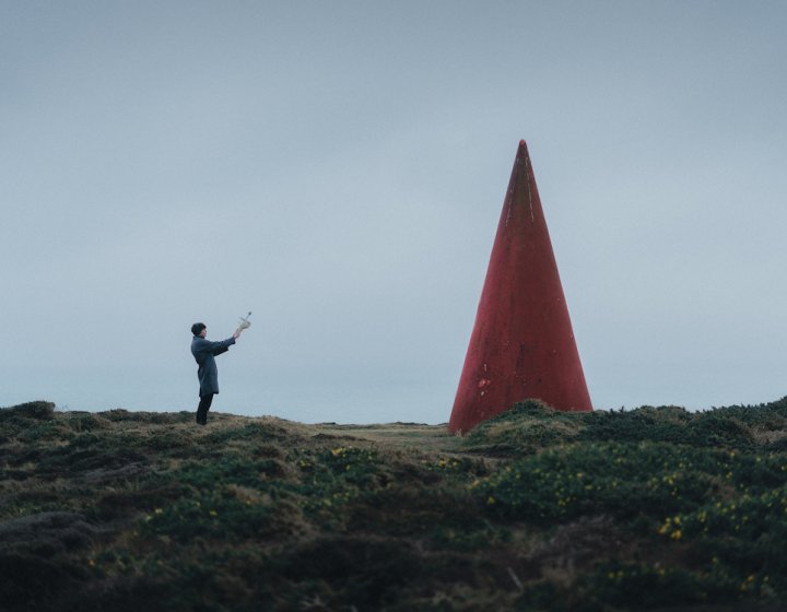 Person holding radio to the sky