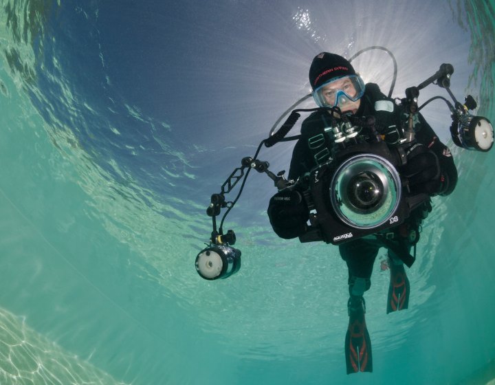 Falmouth University Marine Photography student underwater with diving gear and camera
