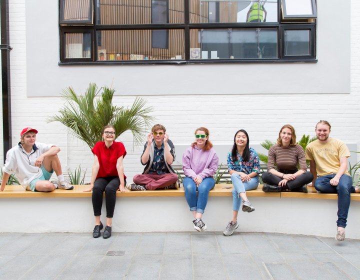 Students sat on wall