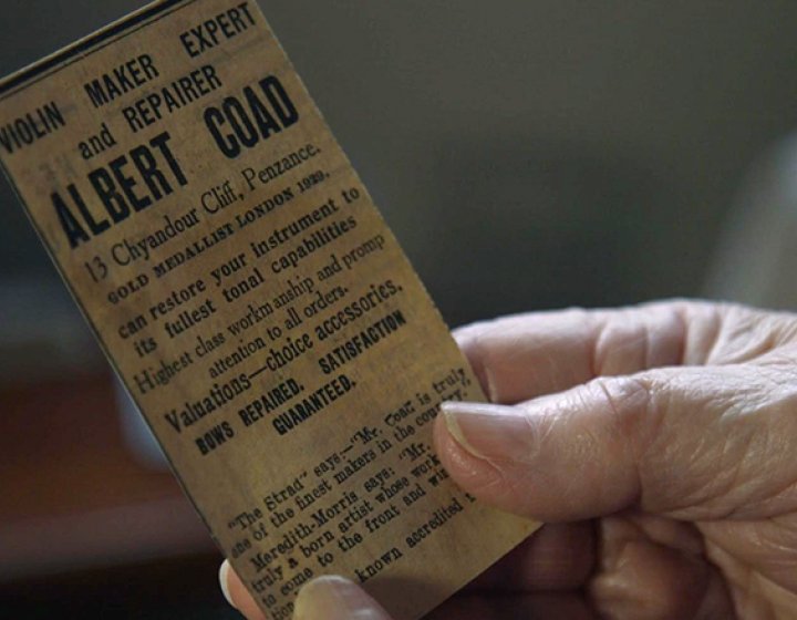 hand holding a ticket