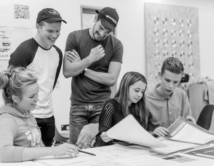 Students working in the Graphic Design Studio at Falmouth University