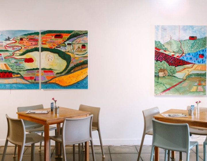 Seats and paintings in a cafe environment