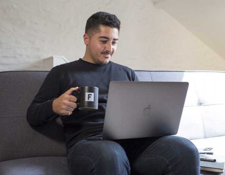 A short course student working on their laptop