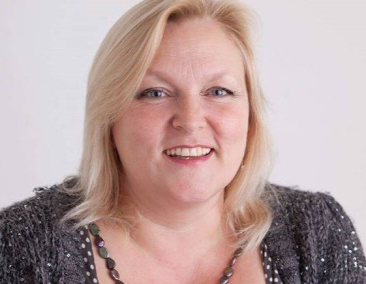 A headshot of author Lynn Huggins-Cooper