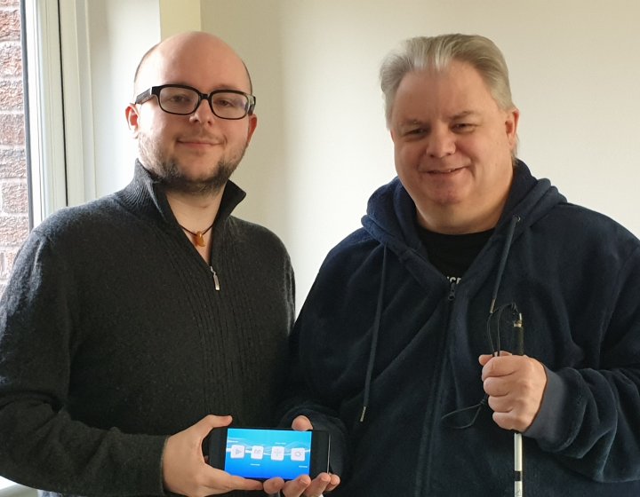 Elliott Dodsworth standing next to his visually impaired father