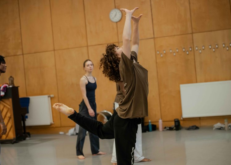 A dancer posing in the centre of the image