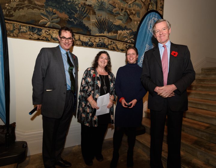 ba in creative writing online Two women and two men posing by stairs and in front of a large tapestry