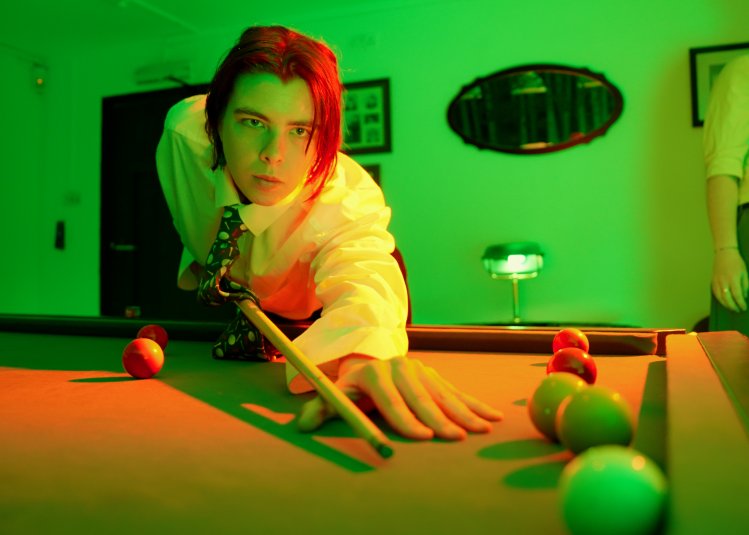 A student playing pool