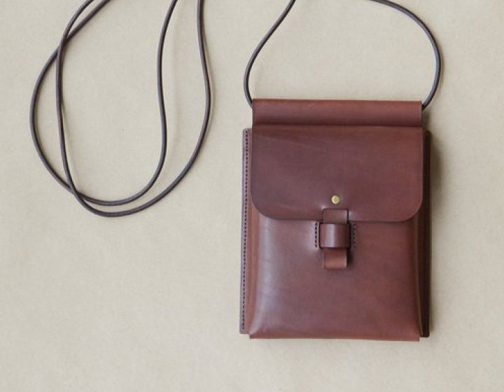 Brown leather small cross body bag with cord strap