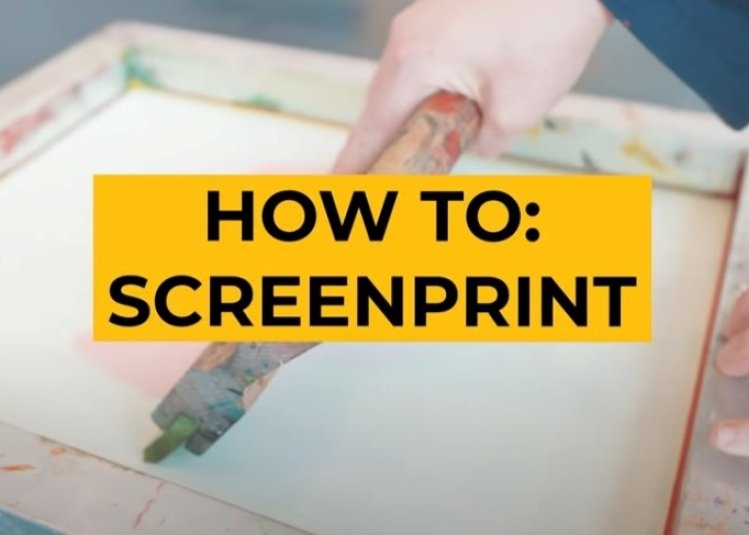 Photo of hands over a screen printing board with yellow box on top with the words 'How to: screen print' overlaid.