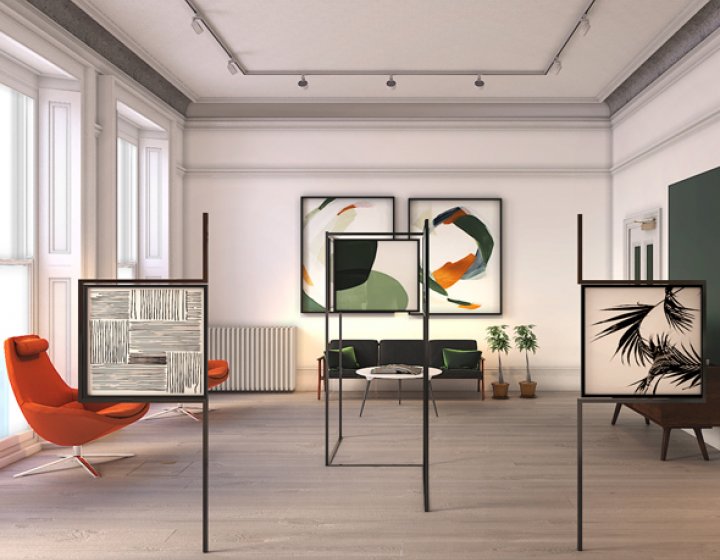 Interior design of large room with orange and green chairs and framed patterns