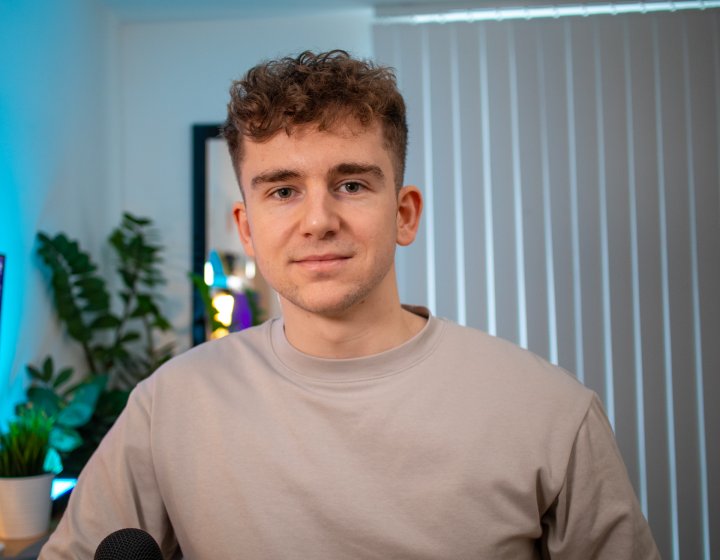 MA UX Design graduate Jack Jenkins sitting in his home office 