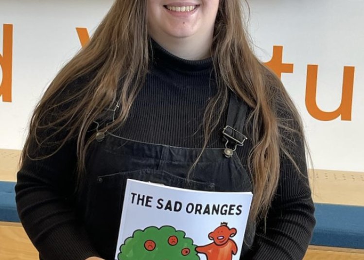 Launchpad student Charlii Testar holding book