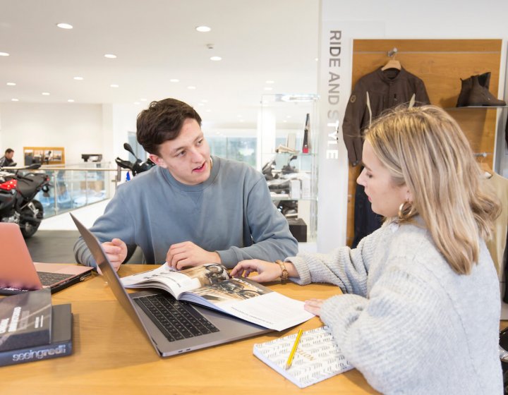 Student sitting in work placement at BMW garage