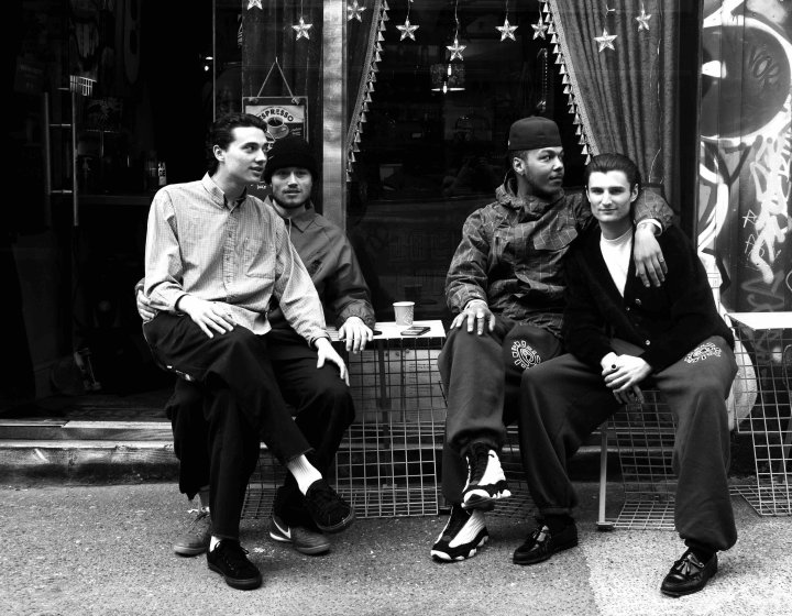 Four people sitting outside a cafe on Brick Lane photo by Alice McDonald