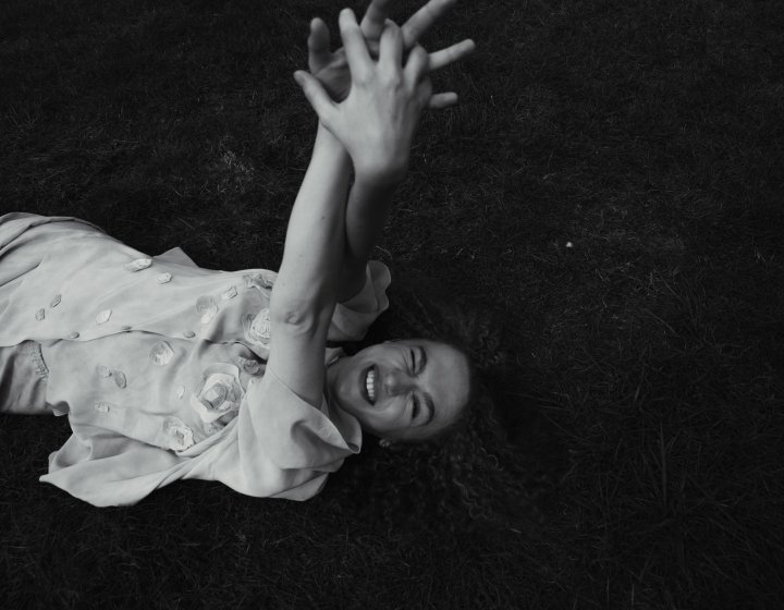 A girl lying in a field