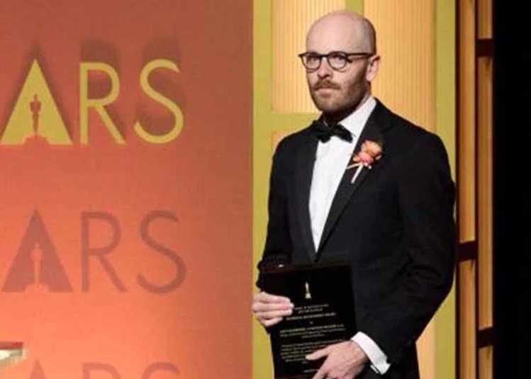 A graduate with an Oscar