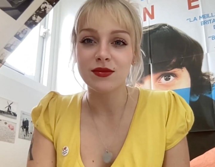 A Falmouth University student wearing a yellow top