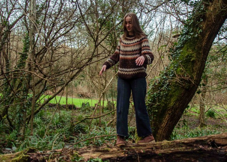 Emily Collis, Musician, standing in a woodland scene