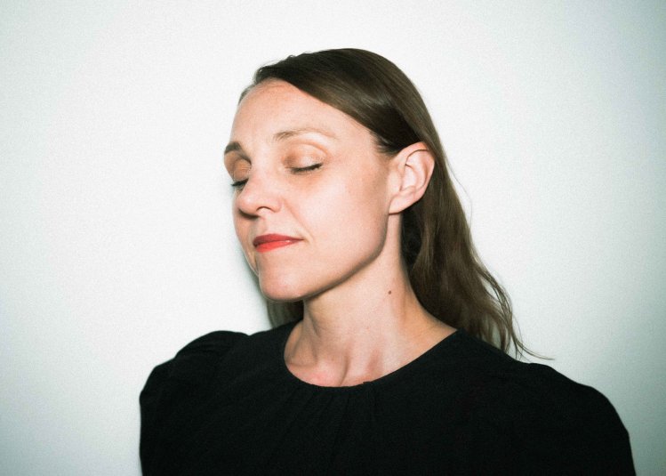 A headshot image of dance & choreographer Emily Alden