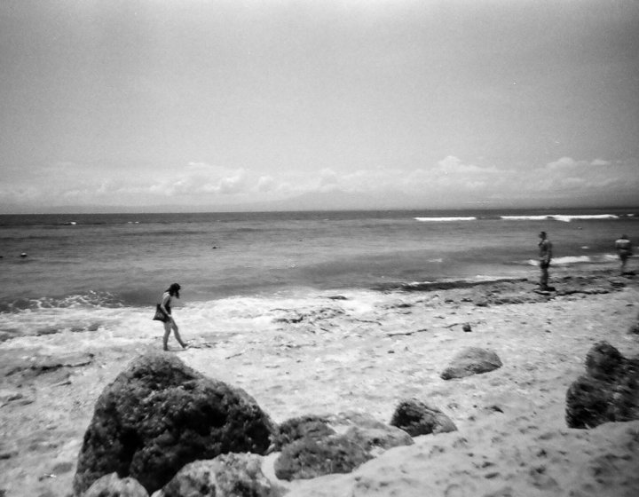A black and white image of a beach