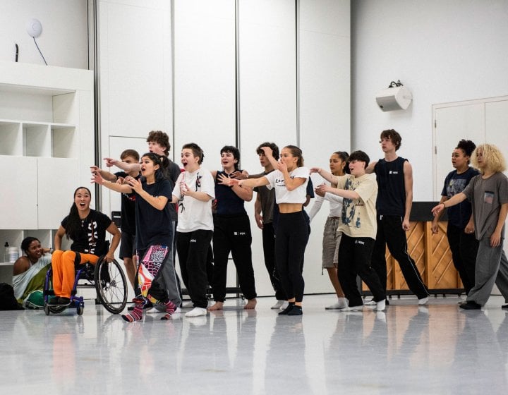 A group of young dancers in a line posing