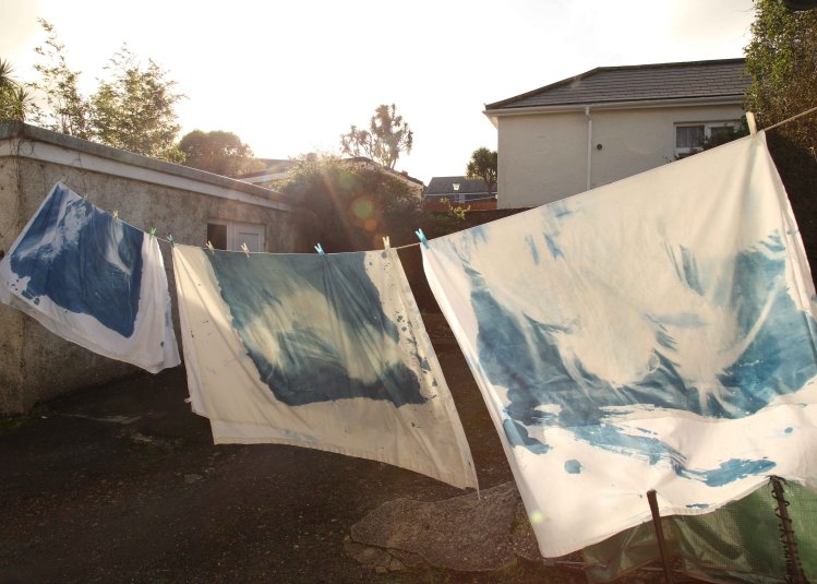 An external image of painted cloth on a washing line