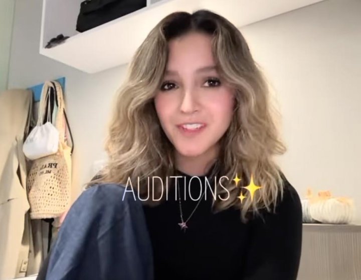 A Falmouth University student in an interior with the subtitle 'Auditions'