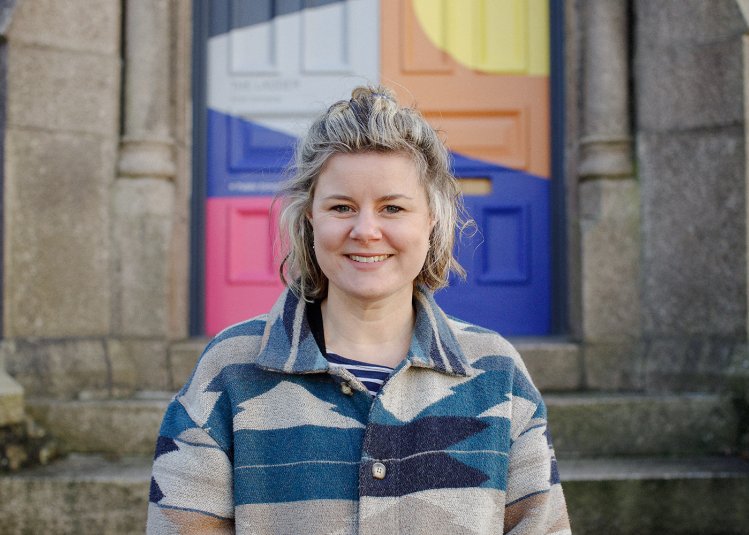 A woman stood outside a building