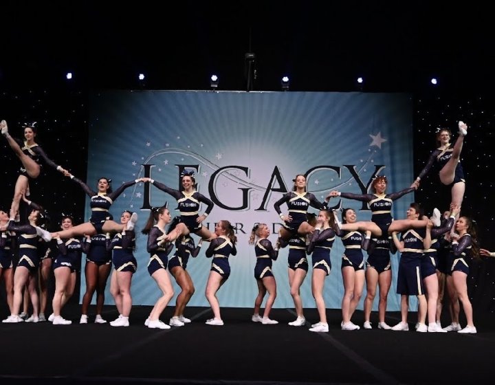 The Falmouth University cheerleading club performing on a stage