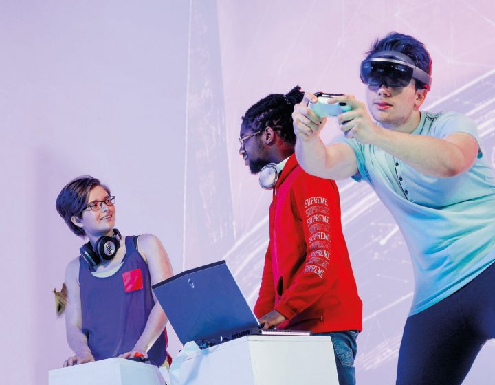 Student with VR set and hand controller