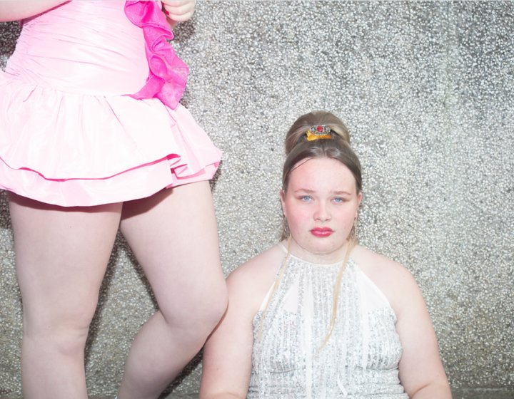 Portrait of Cornish girl wearing dress, makeup and tiara - from Cornish Maids photography project by Fran Rowse