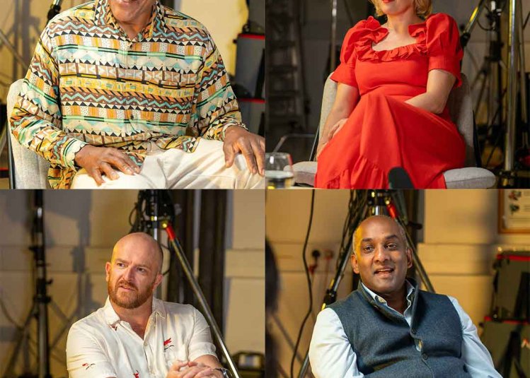 Four people being interviewed in a studio