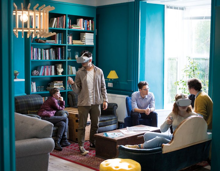 Students with VR headsets in writing studio