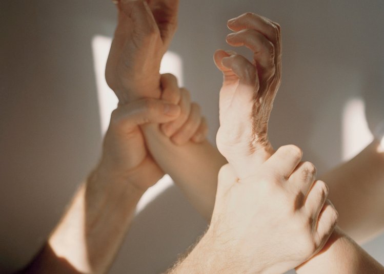 Photography: person holding another person by the wrists 